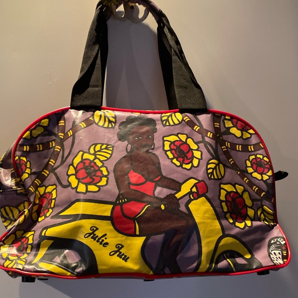 Stylish Purple and Red Travel Bag with Modern Design.